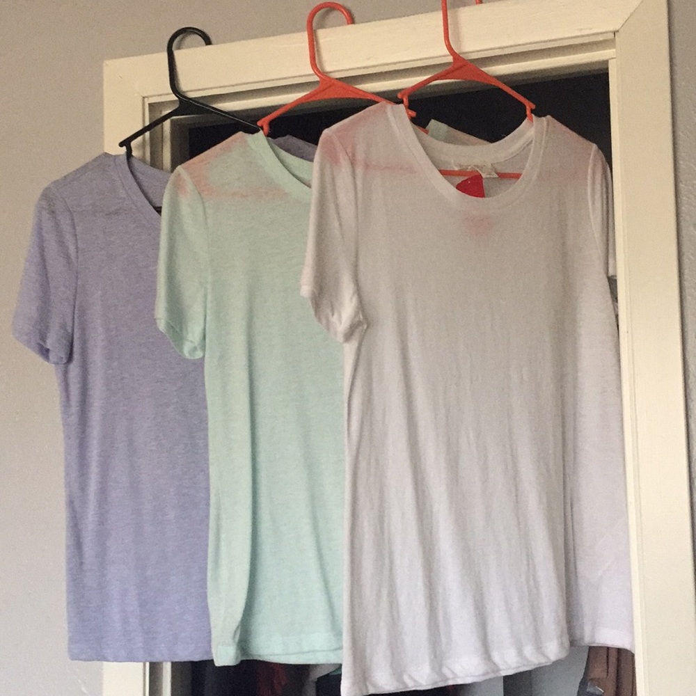Light blue, White, and Green T shirts